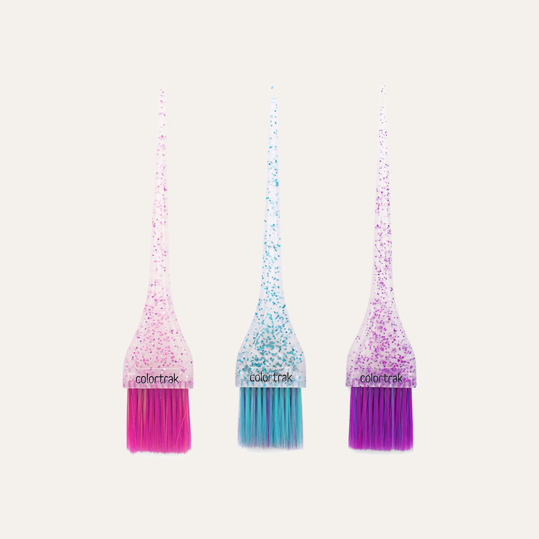 Two overlapping mini glitter color brushes with pink and blue bristles