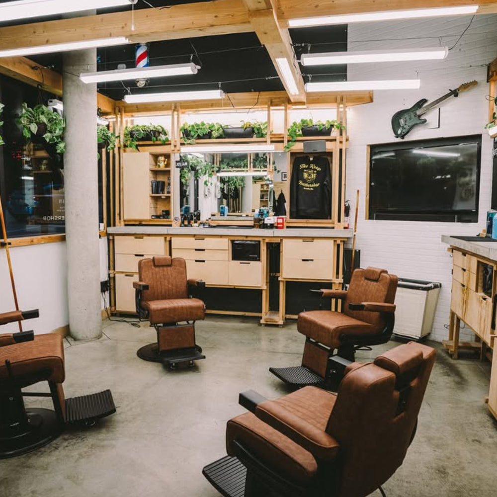 Modern salon with black styling chairs and gold bases