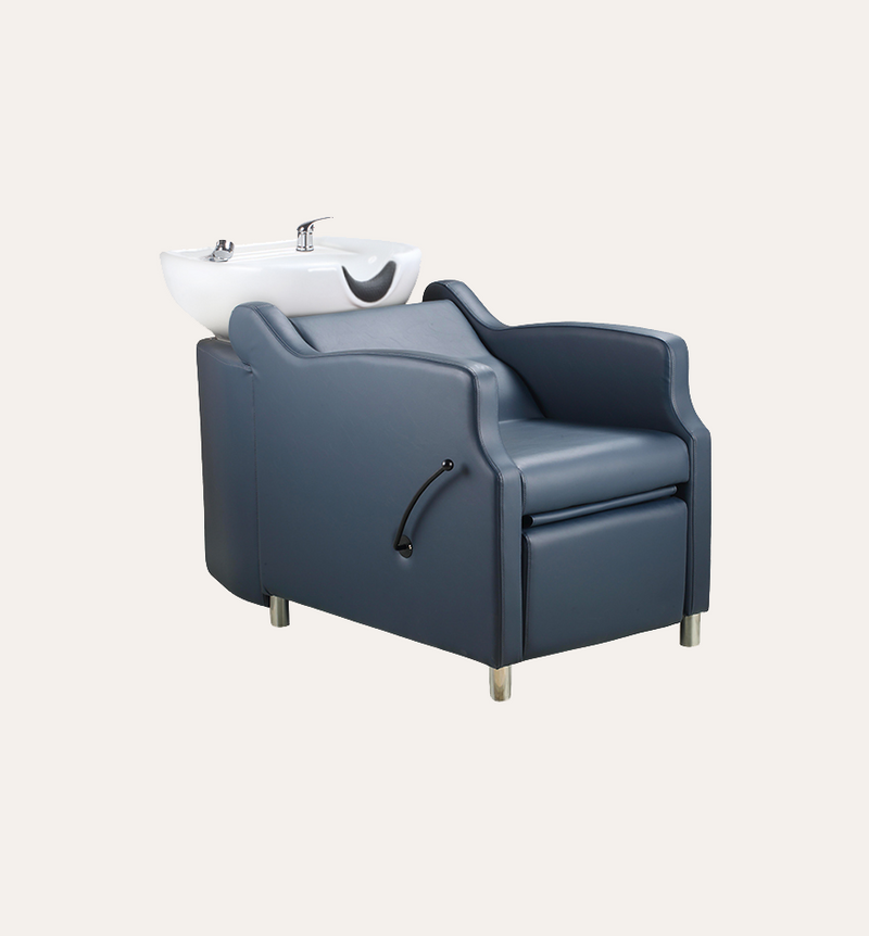 Blue salon chair with a white sink on a light gray background
