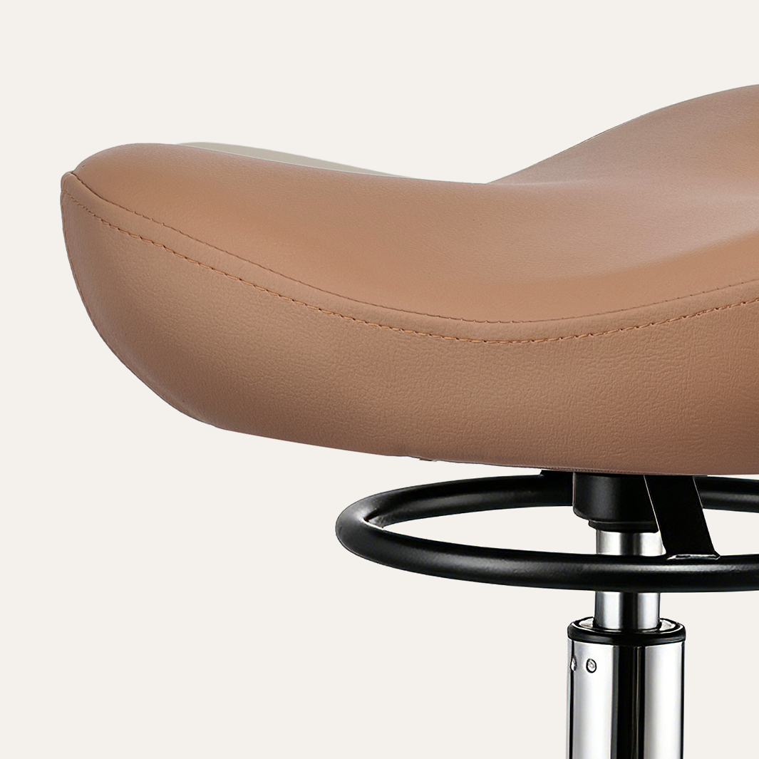 Close-up of a brown leather stool with a white background