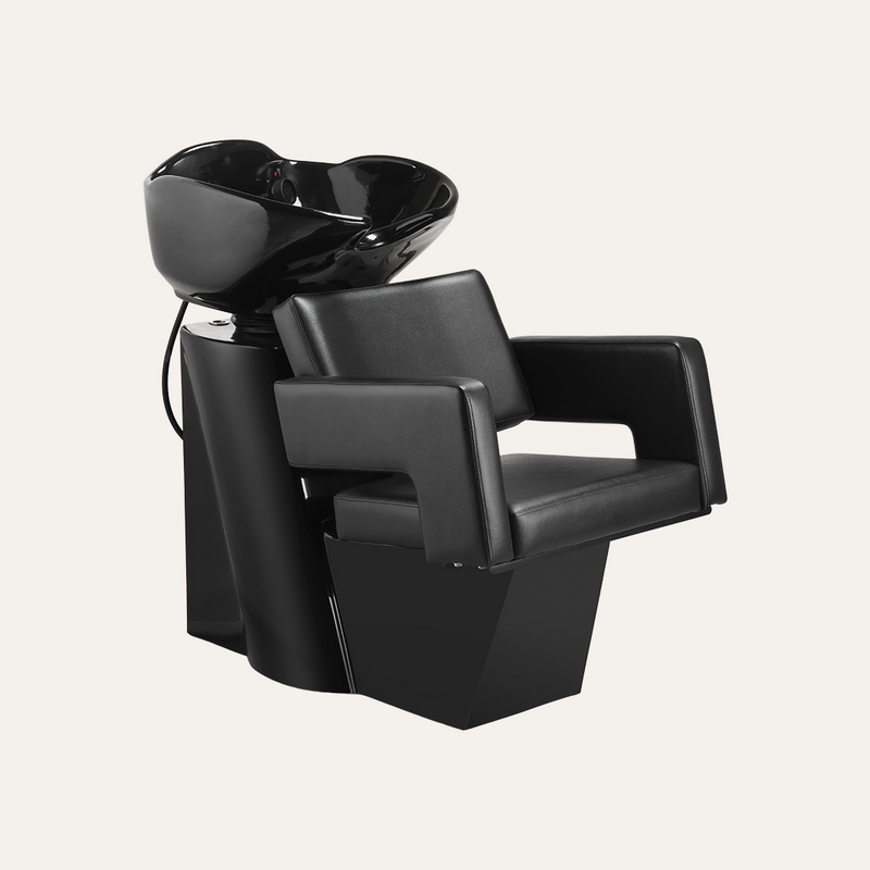 Black hair washing chair with basin on a white background