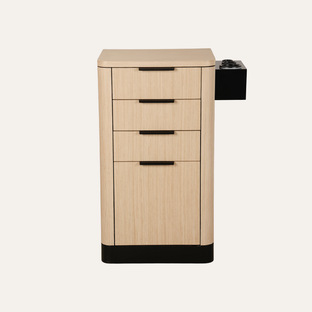 A modern four-drawer cabinet with a light oak wood grain finish, black drawer pulls, and a black base, featuring an integrated side-mounted black utility hook on the right side, shown against a solid off-white background.