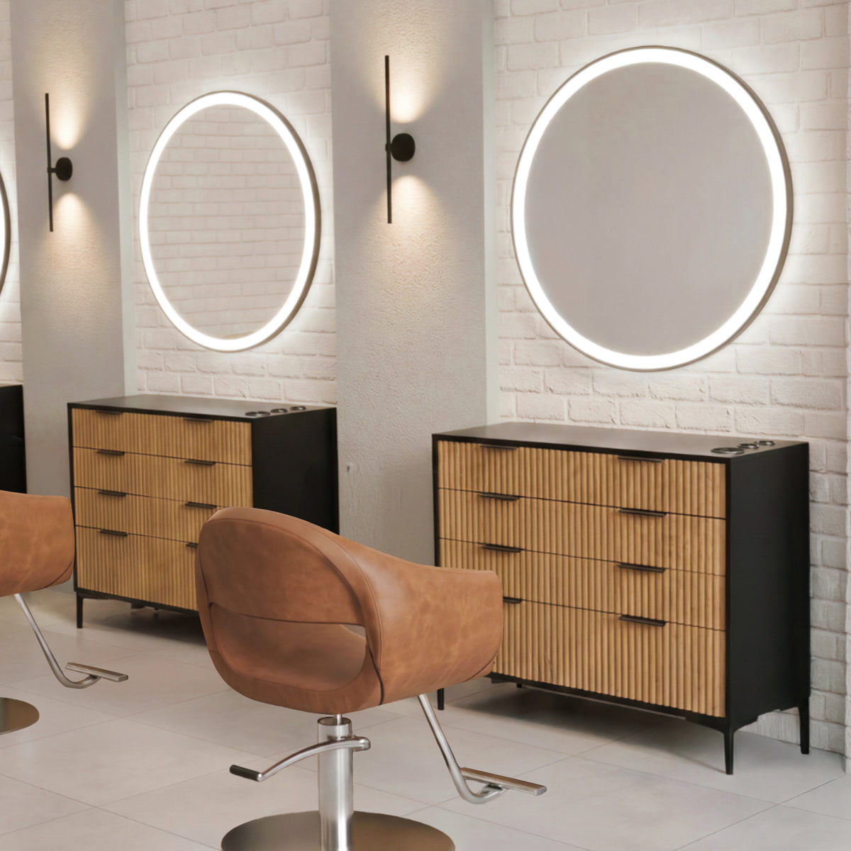 Salon interior with round mirrors, wooden tambour station cabinets, and brown salon chairs.